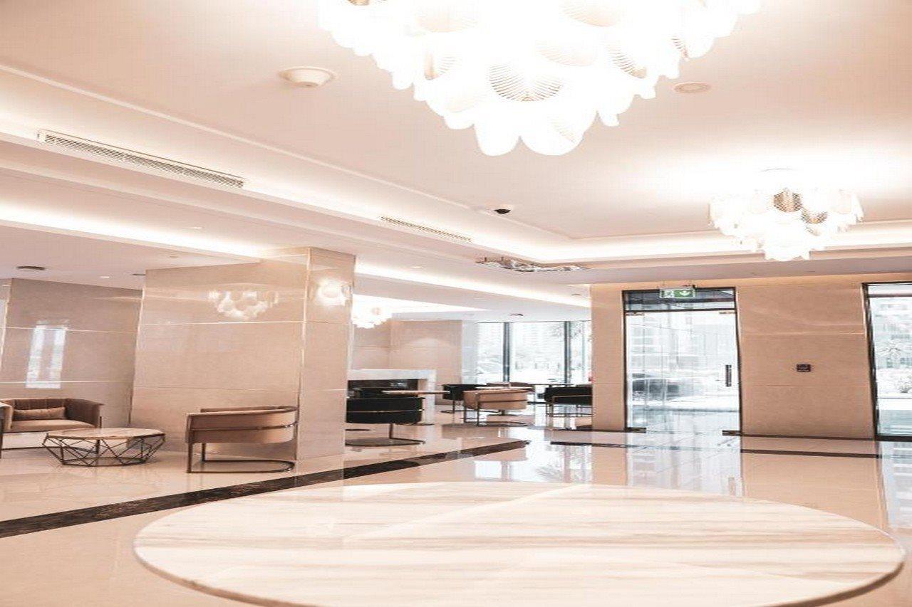 HE Hotel Apartments Dubai Exterior foto Lobby